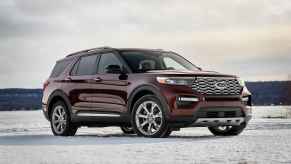 A deep burgundy colored 2020 Ford Explorer parked in right front angle view