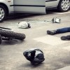 A motorcycle wreck with a man in the road