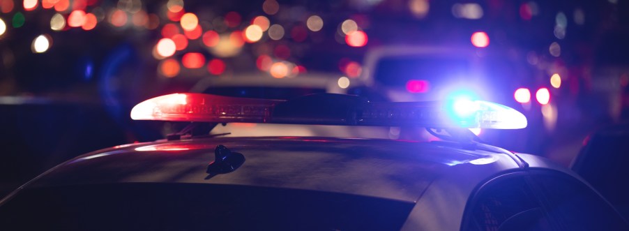 Police car with its lights on at night